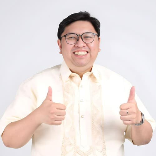 Mervin De Castro in a barong, smiling with two thumbs up
